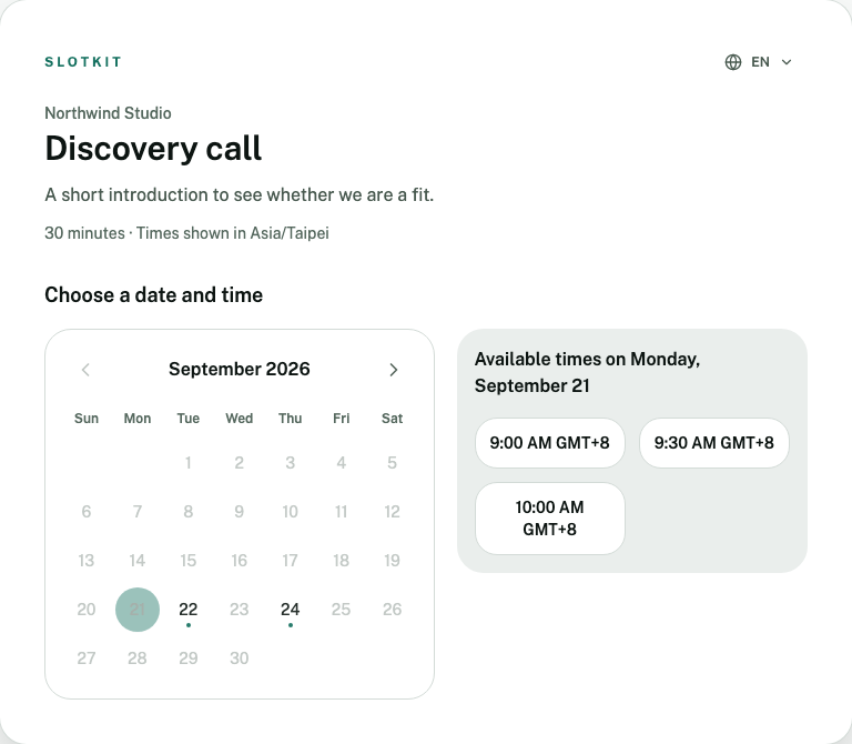 Slotkit hosted booking page showing a month calendar, available times for the selected date, and the language switcher